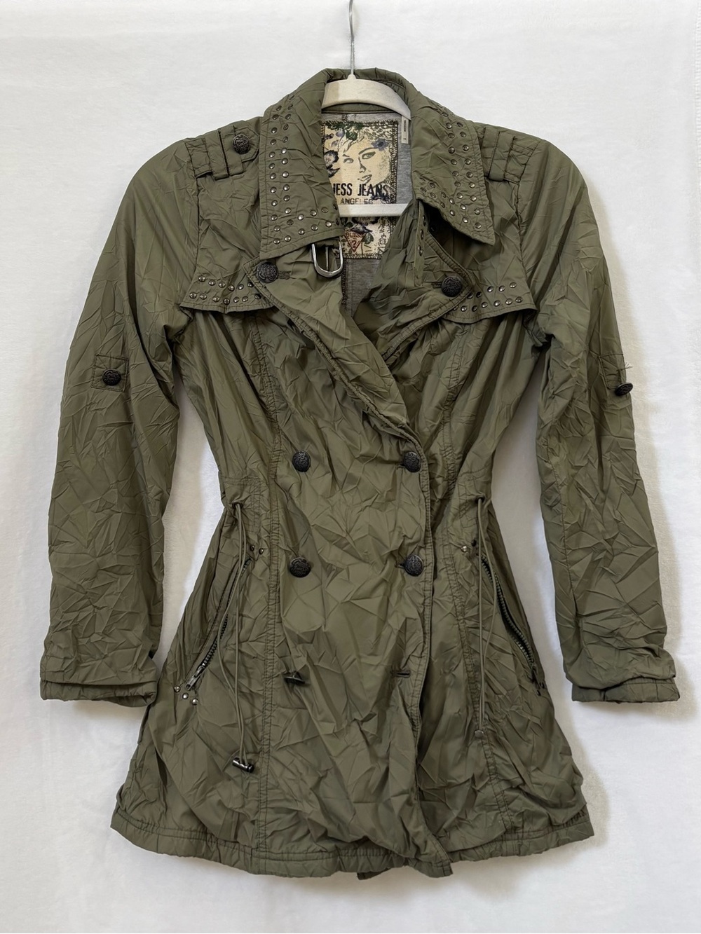 Military/utility-inspired short trench coat with Y2K edginess.